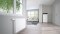 The picture shows a modern home with a ViCare thermostatic radiator valve